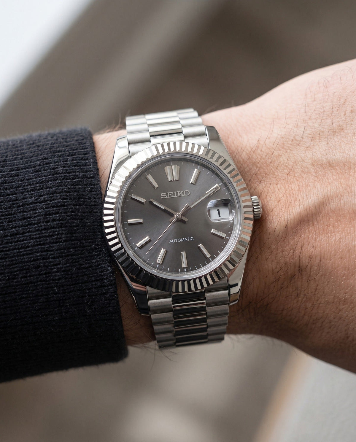 Grey Sunburst President on the wrist