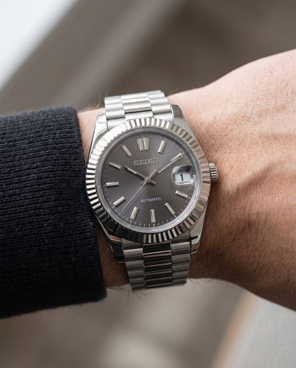Grey Sunburst President on the wrist